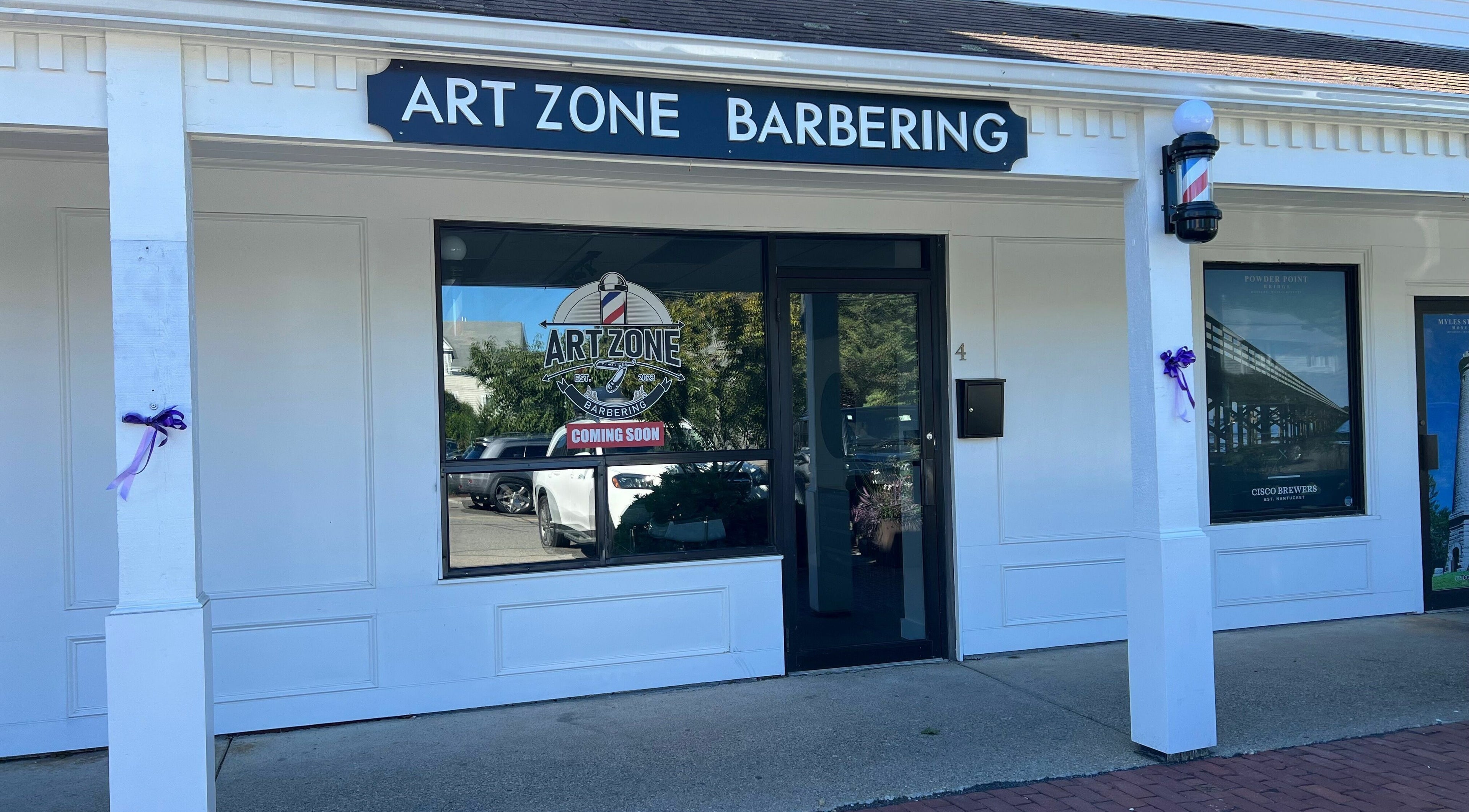 Entrance of Art Zone Barbering in Massachusetts, Massachusetts, US features modern design and welcoming ambiance.