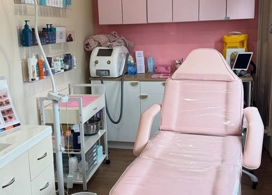 Treatment room at Maddi's Cosmetic Clinique, Melbourne, Victoria, AU with equipment and a comfortable chair.