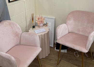 Elegant pink seating at Maddi's Cosmetic Clinique, Melbourne, Victoria, AU, offering calm and relaxation.