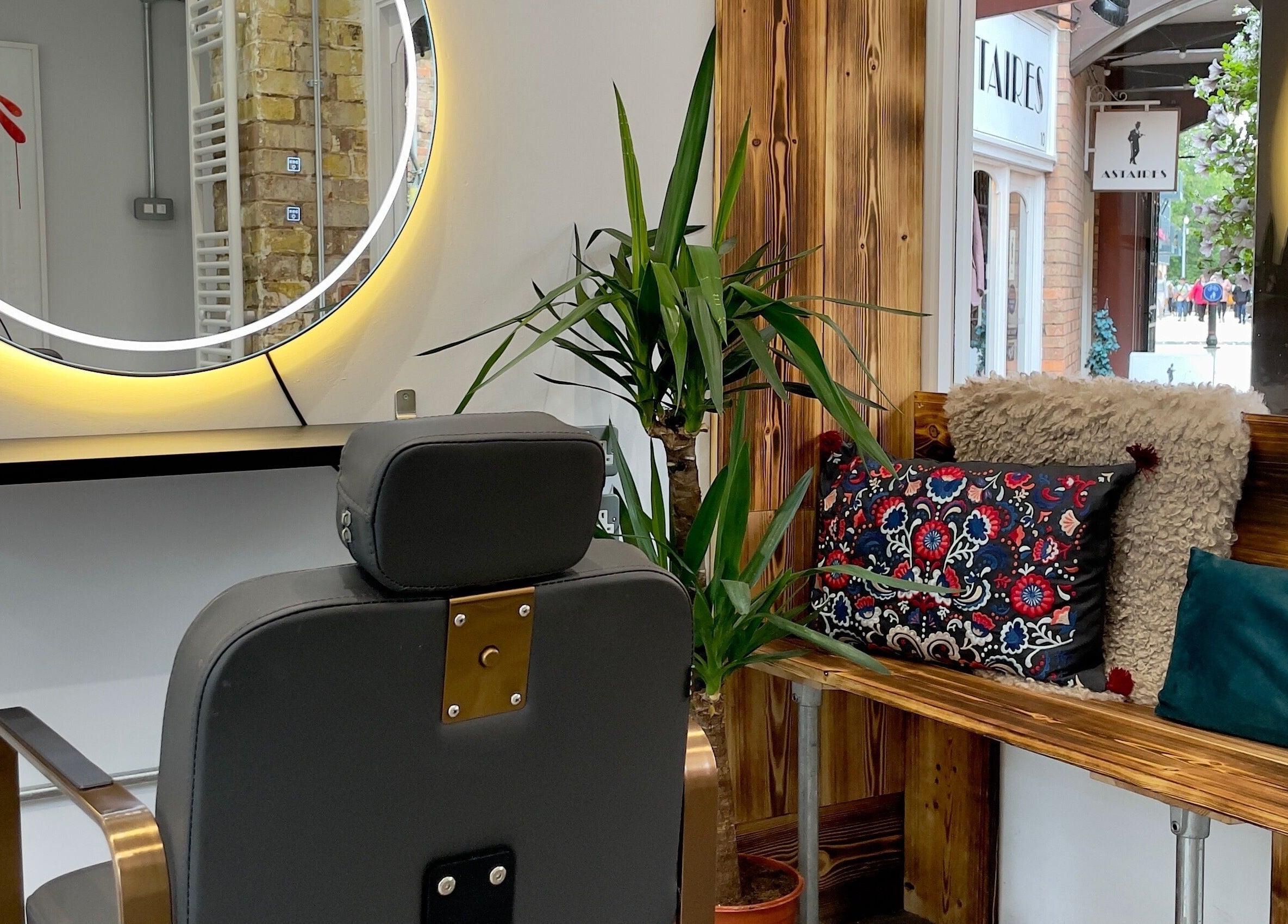 Stylish salon chair and cozy seating at HAIR By Joshua Jones, Taunton, England, GB.