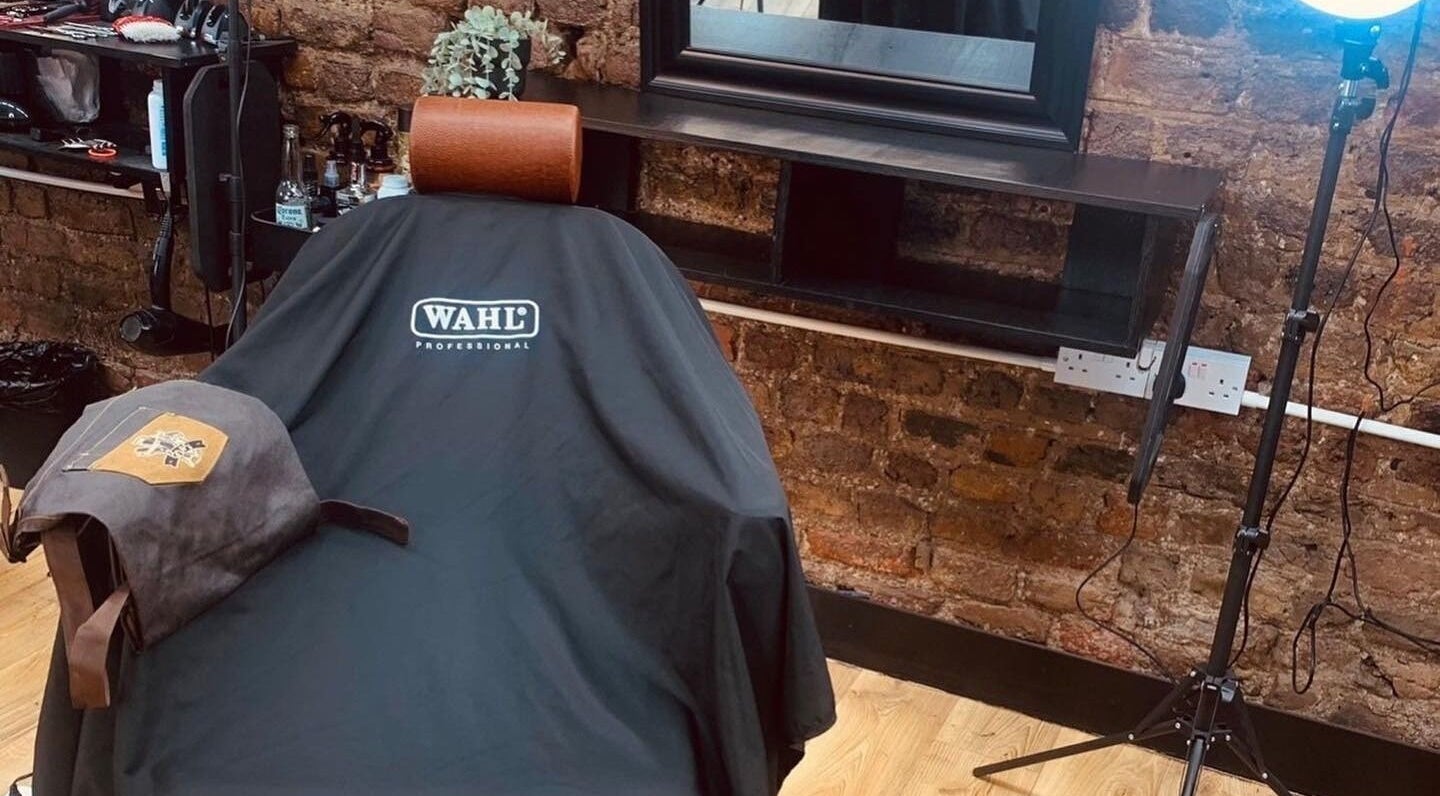 Cozy interior of Bros Barber Shop in Dublin featuring a barber chair and rustic decor.