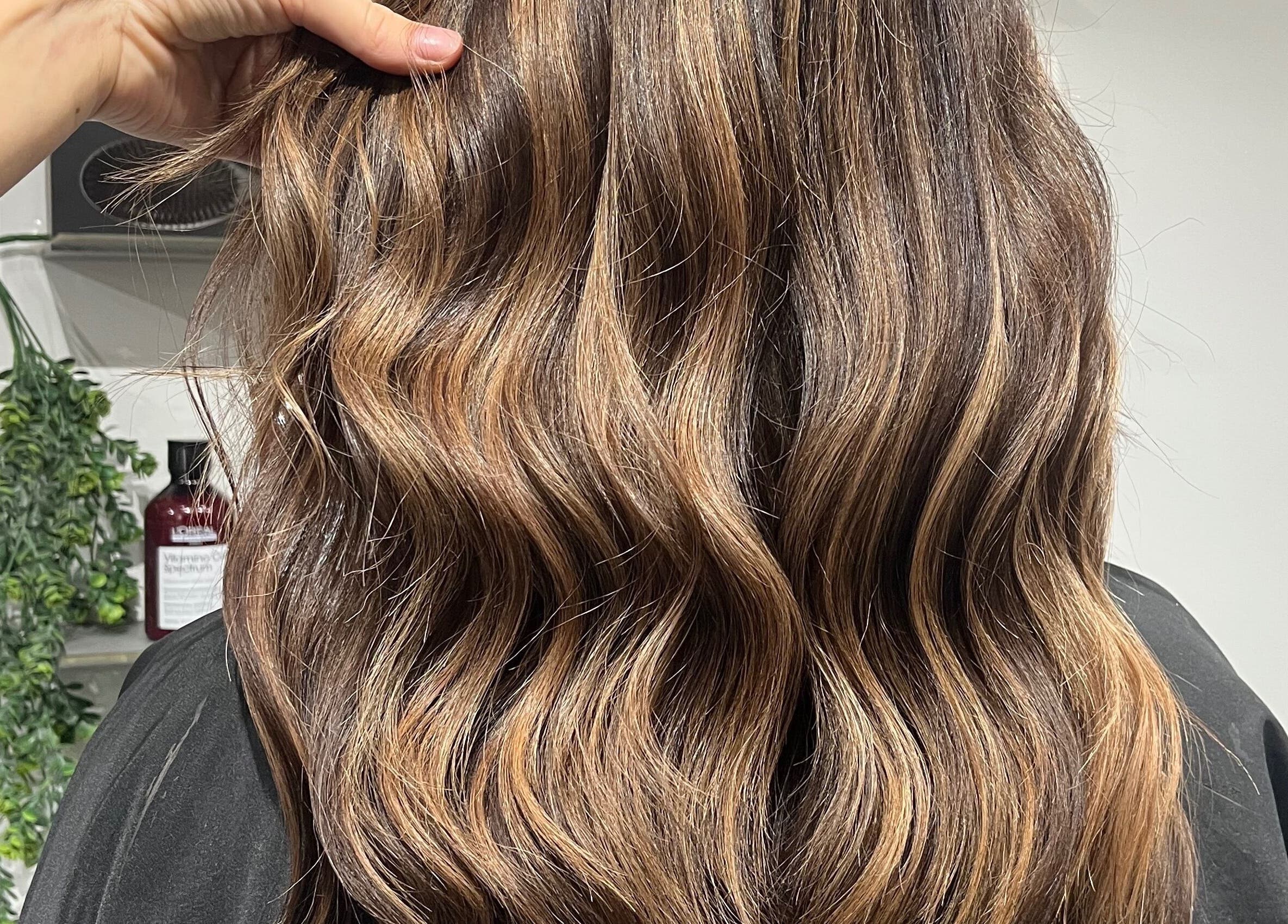 Stylish wavy hair transformation at Eclipse Hair Salon, Houghton Regis, England, GB.