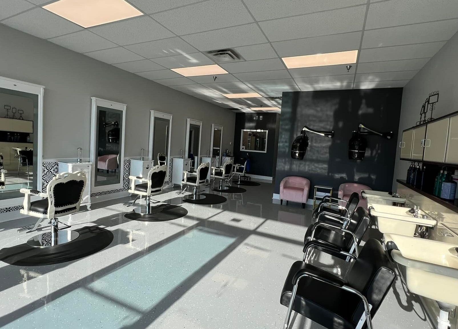 Elegant interior of The A Salon and Spa in Lyman, South Carolina, US with classic styling chairs and mirrors.