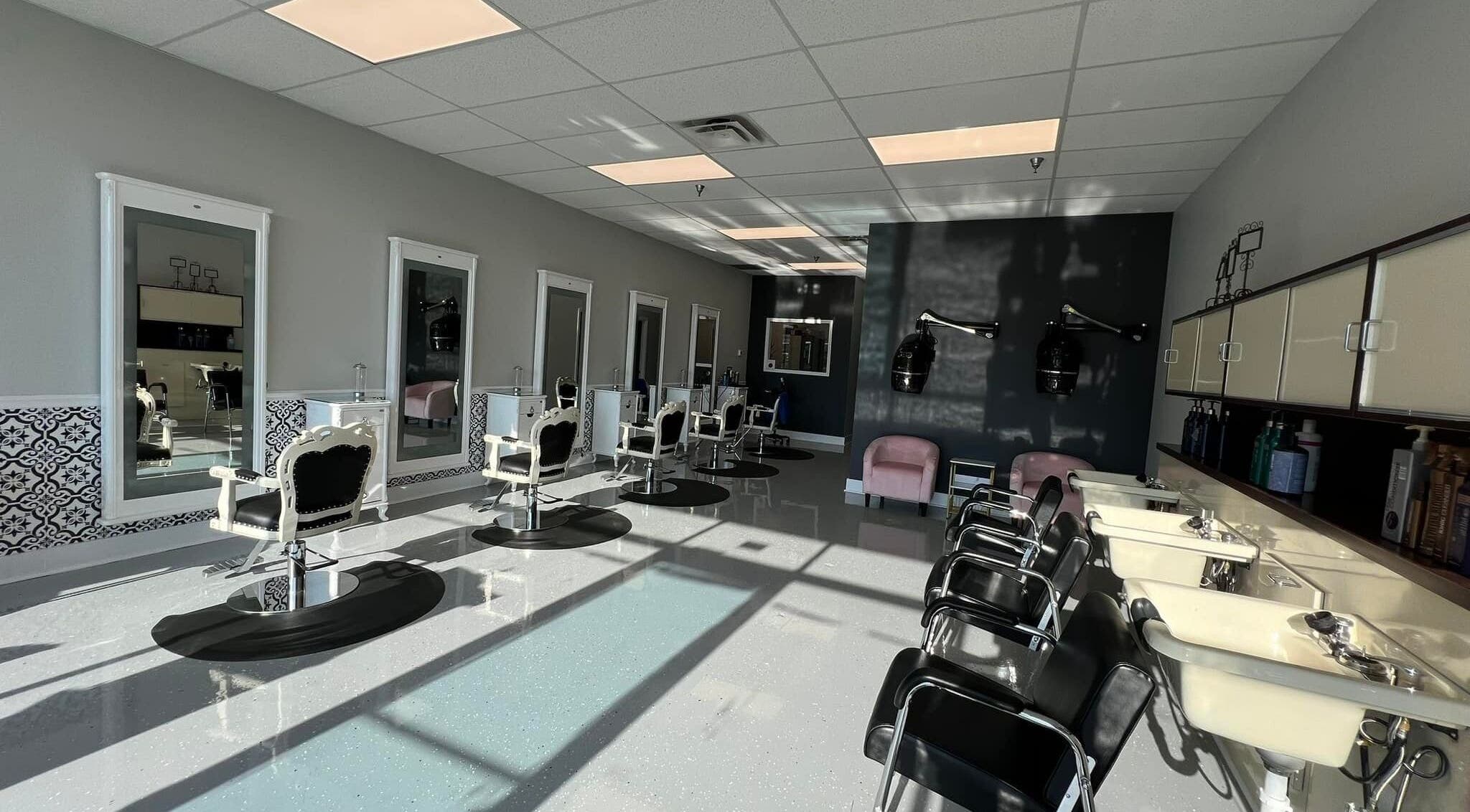 Elegant interior of The A Salon and Spa in Lyman, South Carolina, US with classic styling chairs and mirrors.