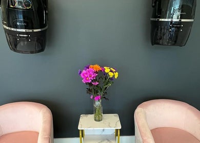 Chic seating area with pink chairs at The A Salon and Spa, Lyman, South Carolina, US.