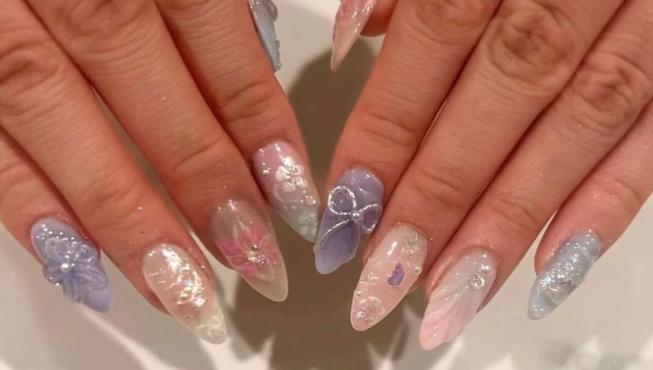 Elegant pastel nail art at Nails By Hineni in Brambleton, Virginia, US featuring intricate designs.