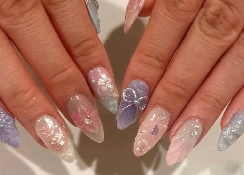 Elegant pastel nail art at Nails By Hineni in Brambleton, Virginia, US featuring intricate designs.