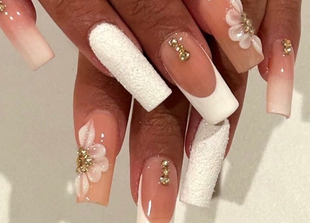 Beautiful floral nail art with rhinestones at Nails By Hineni, Brambleton, Virginia, US.