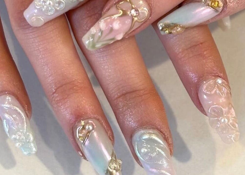Intricate nail art design at Nails By Hineni, Brambleton, Virginia, US.
