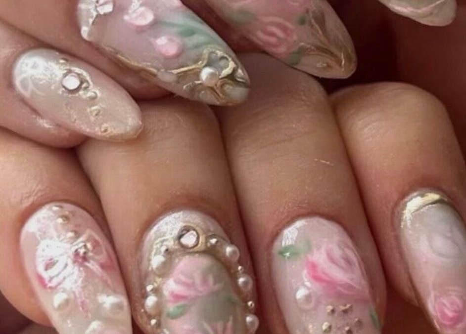 Intricate floral nail art at Nails By Hineni in Brambleton, Virginia, US enhances beauty and style.