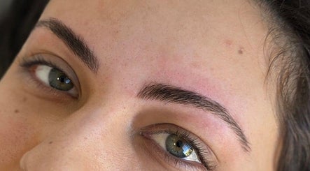 Freshly shaped eyebrows at Blade It Babe in South Surrey, British Columbia, CA, showcasing expert grooming.