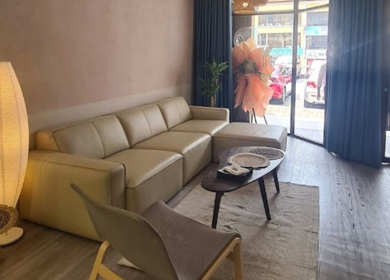 Relaxing lounge area in Adam’s Parlour, Kuala Lumpur, with stylish seating and ambient lighting.