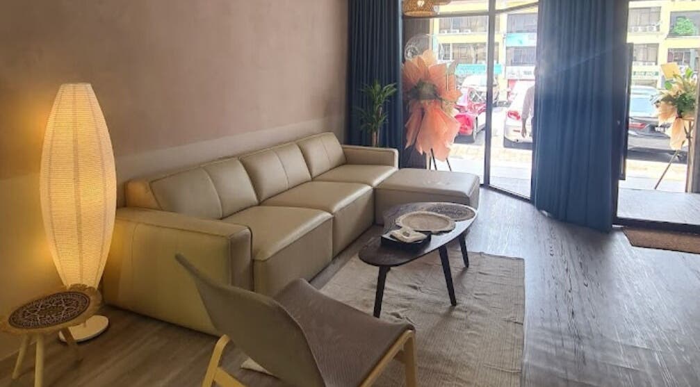 Relaxing lounge area in Adam’s Parlour, Kuala Lumpur, with stylish seating and ambient lighting.