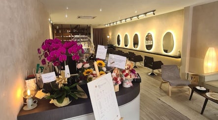 Adam’s Parlour interior with vibrant flowers and stylish chairs in Kuala Lumpur, Wilayah Persekutuan Kuala Lumpur, MY.