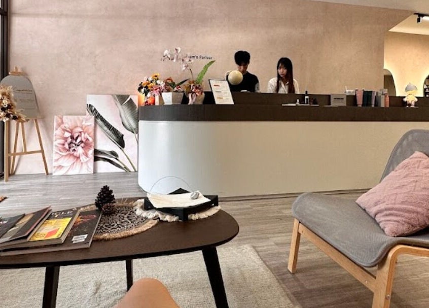 Reception area of Adam’s Parlour, Kuala Lumpur, featuring modern decor and a cozy seating area.