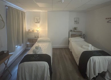 Peaceful massage room at Nalin Thai Massage Therapy in Derby, England, GB with two beds and calming decor.