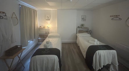 Peaceful massage room at Nalin Thai Massage Therapy in Derby, England, GB with two beds and calming decor.
