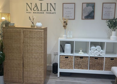 Welcoming interior of Nalin Thai Massage Therapy in Derby, England, GB with plants and wicker furniture.