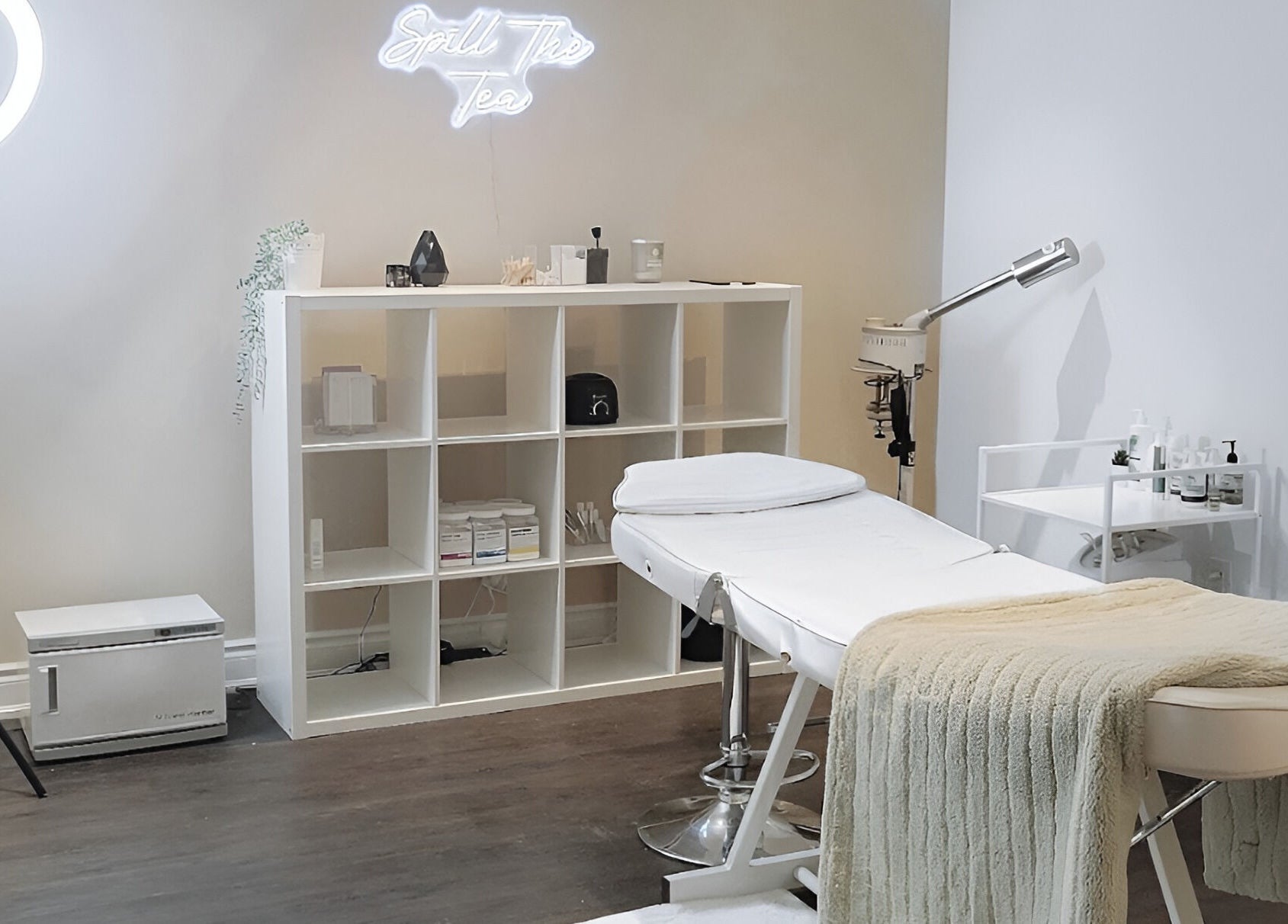 Relaxing treatment room at Glow FX, Barrie, Ontario, CA, featuring a plush bed and calming decor.