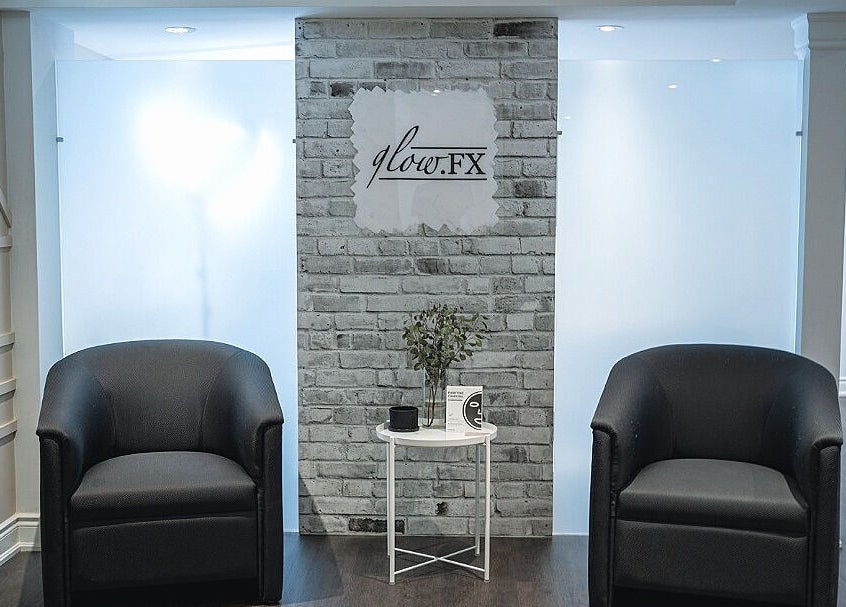 Inviting lounge area at Glow FX, Barrie, Ontario, CA, featuring elegant seating and modern decor.