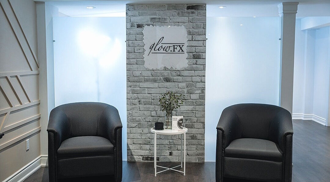 Inviting lounge area at Glow FX, Barrie, Ontario, CA, featuring elegant seating and modern decor.