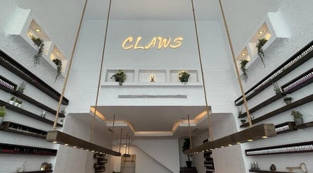 Modern interior of Claws Nail Bar - Jeddah, featuring sleek design and greenery. Located in Jeddah, Makkah Province, SA.