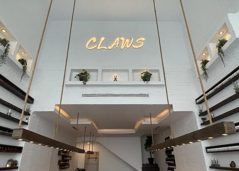 Interior of Claws Nail Bar - Jeddah with chic decor and nail polish display, located in Jeddah, Makkah Province, SA.