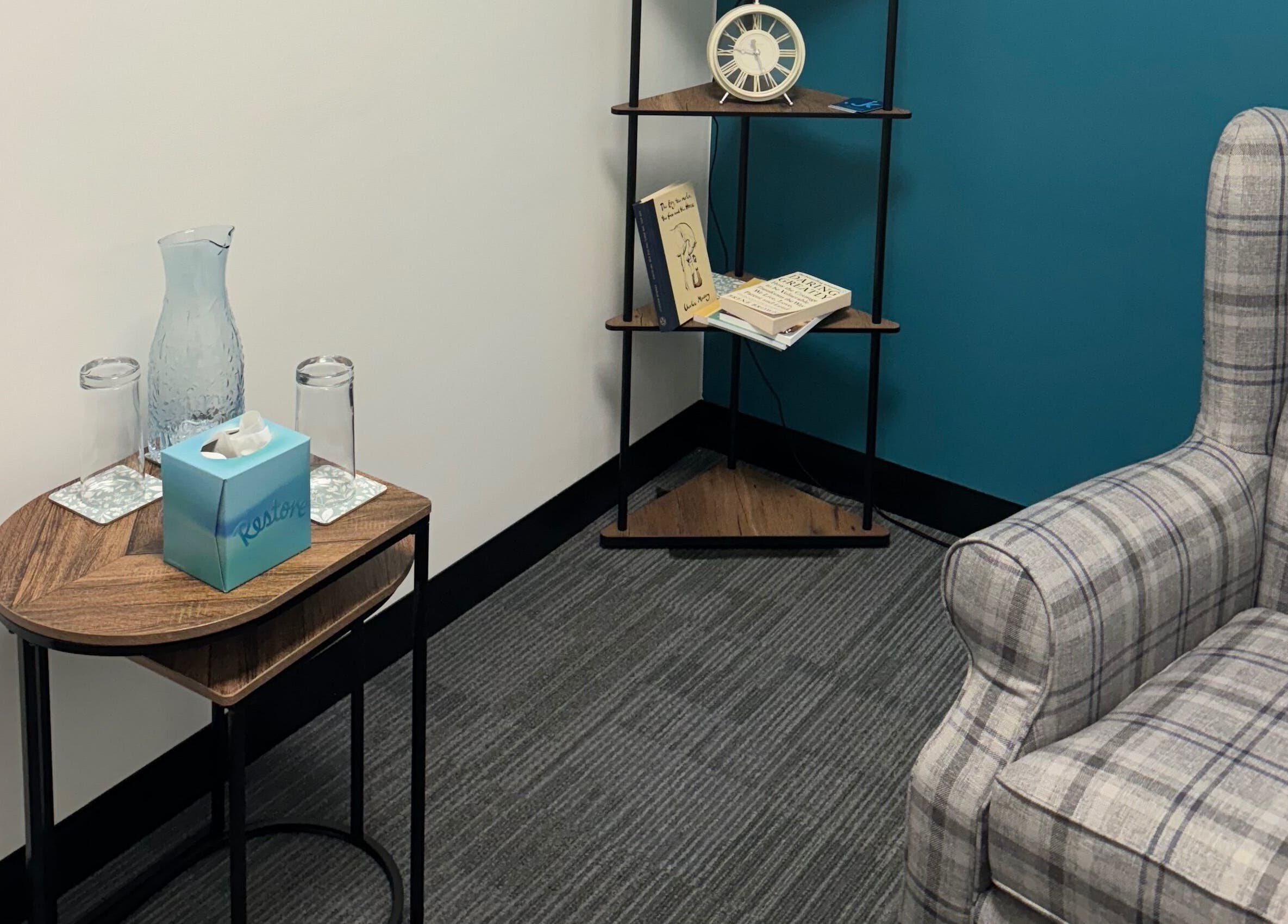 Comfortable counseling room at Emily Nicholls Counselling, Stoke-on-Trent, England, GB with chair and table.