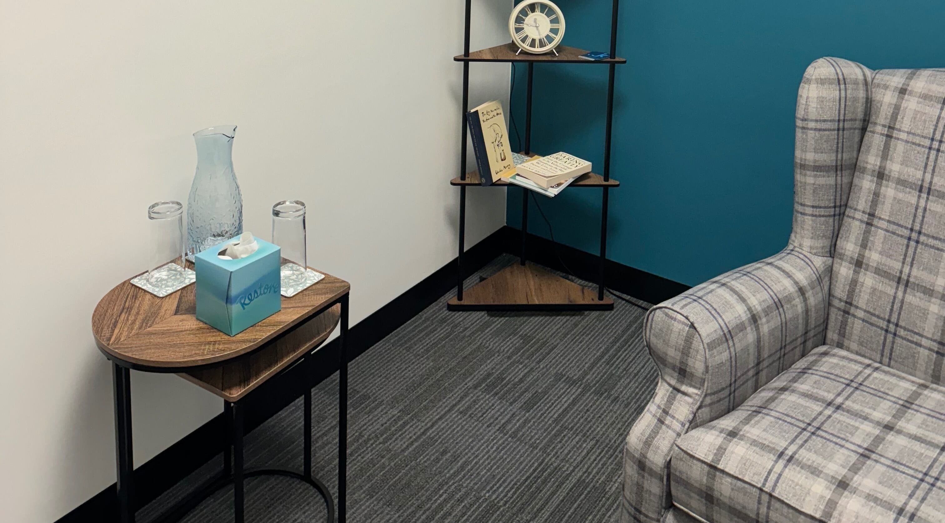 Comfortable counseling room at Emily Nicholls Counselling, Stoke-on-Trent, England, GB with chair and table.