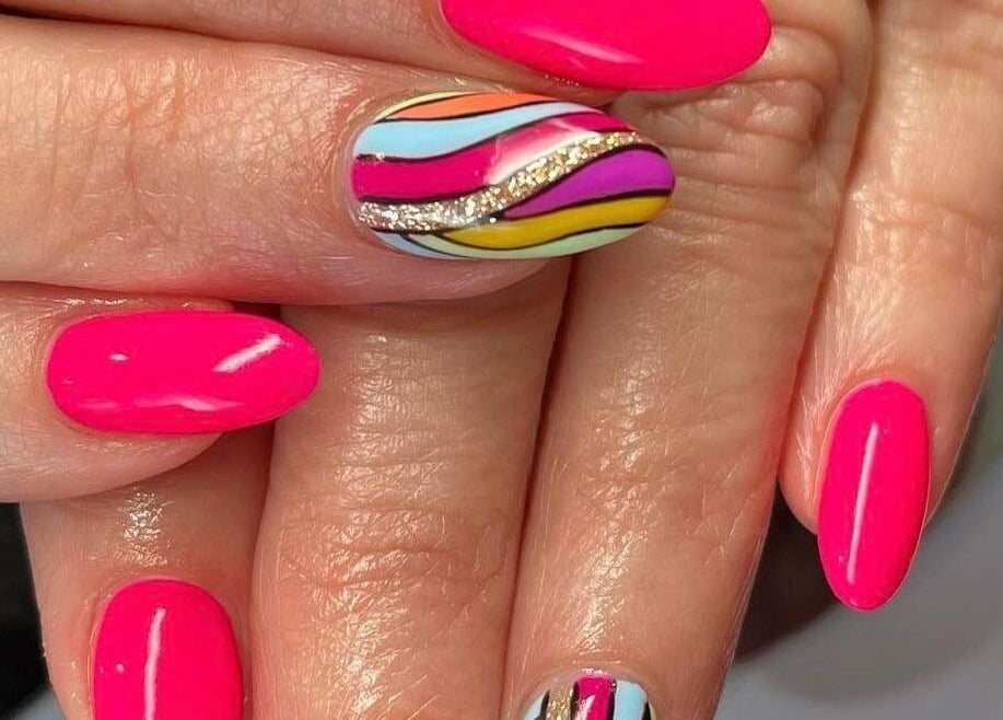 Bright pink and patterned nails at Nail Design by Megan in Fenelon Falls, Ontario, CA.
