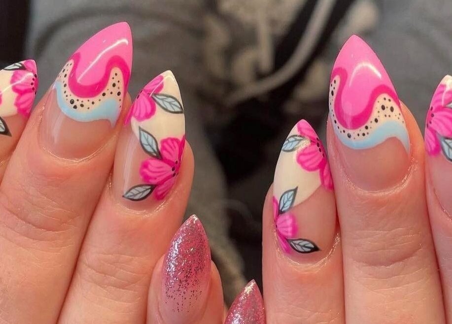 Bright floral nail design at Nail Design by Megan, Fenelon Falls, Ontario, CA. Vibrant pink and intricate details.