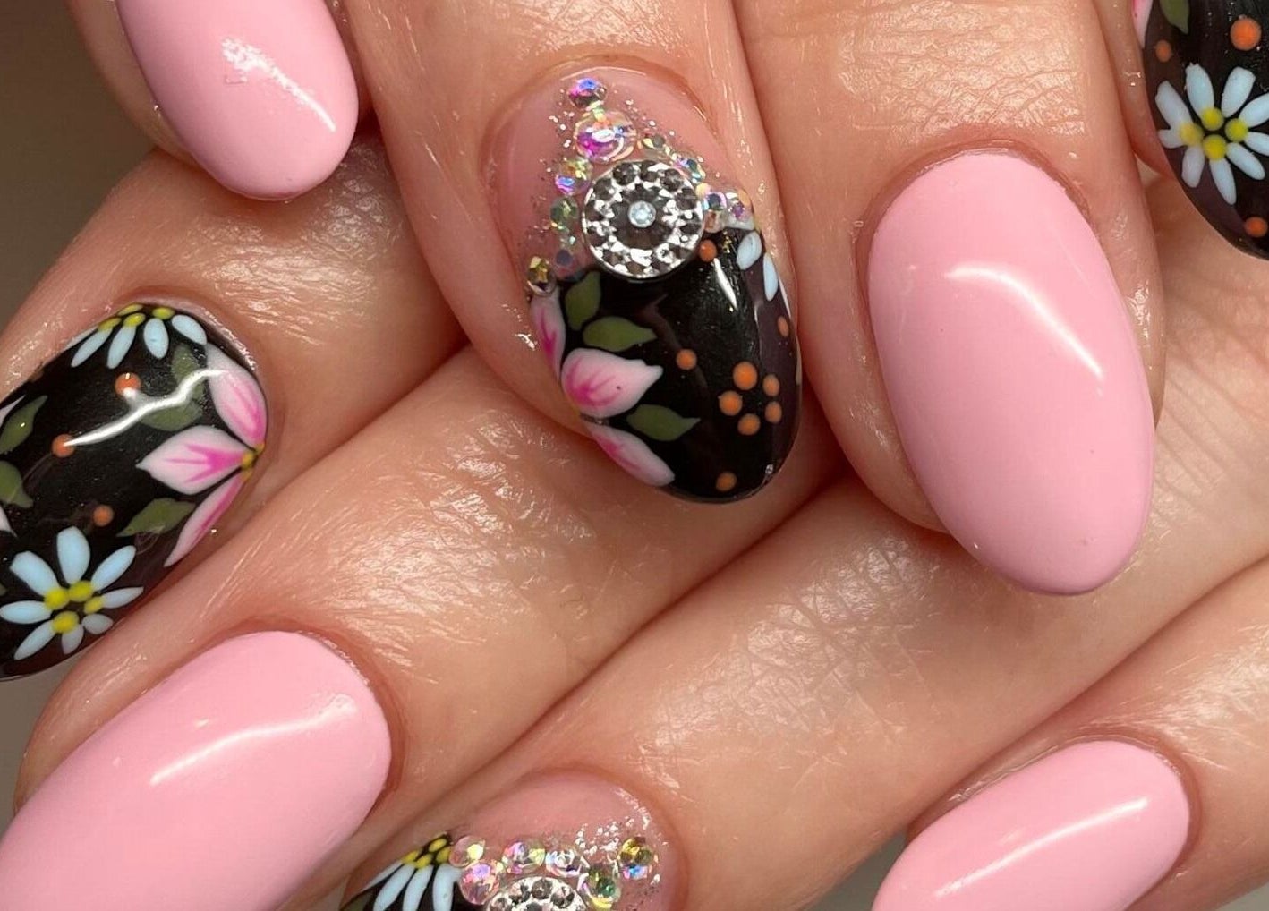 Floral nail art design with pink and black polish at Nail Design by Megan, Fenelon Falls, Ontario, CA.