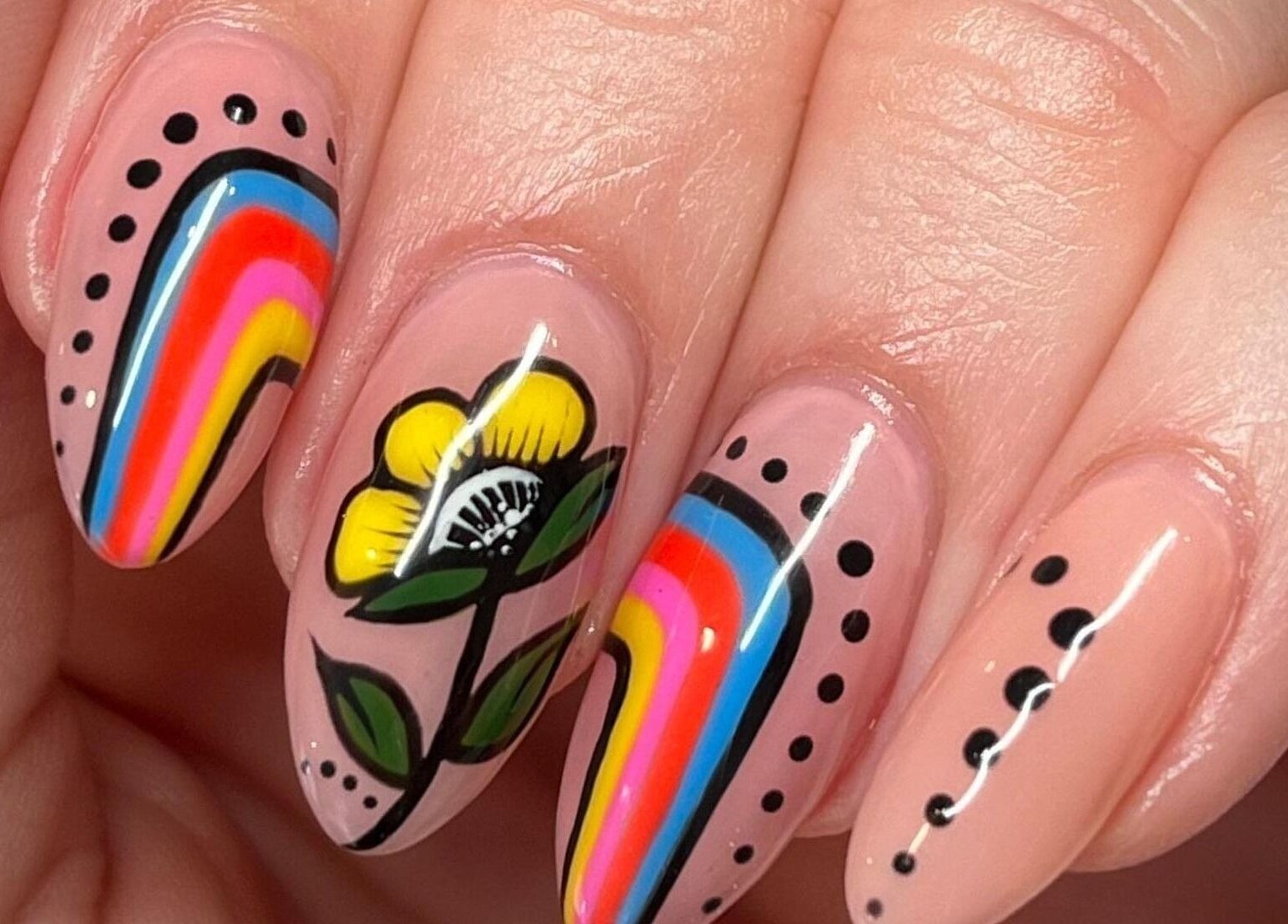 Colorful nail art with floral designs at Nail Design by Megan, Fenelon Falls, Ontario, CA.
