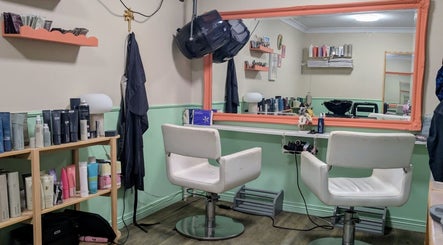 Interior of Awesome Hair Is in Eagleby, Queensland, AU showcasing stylish salon chairs and beauty products.