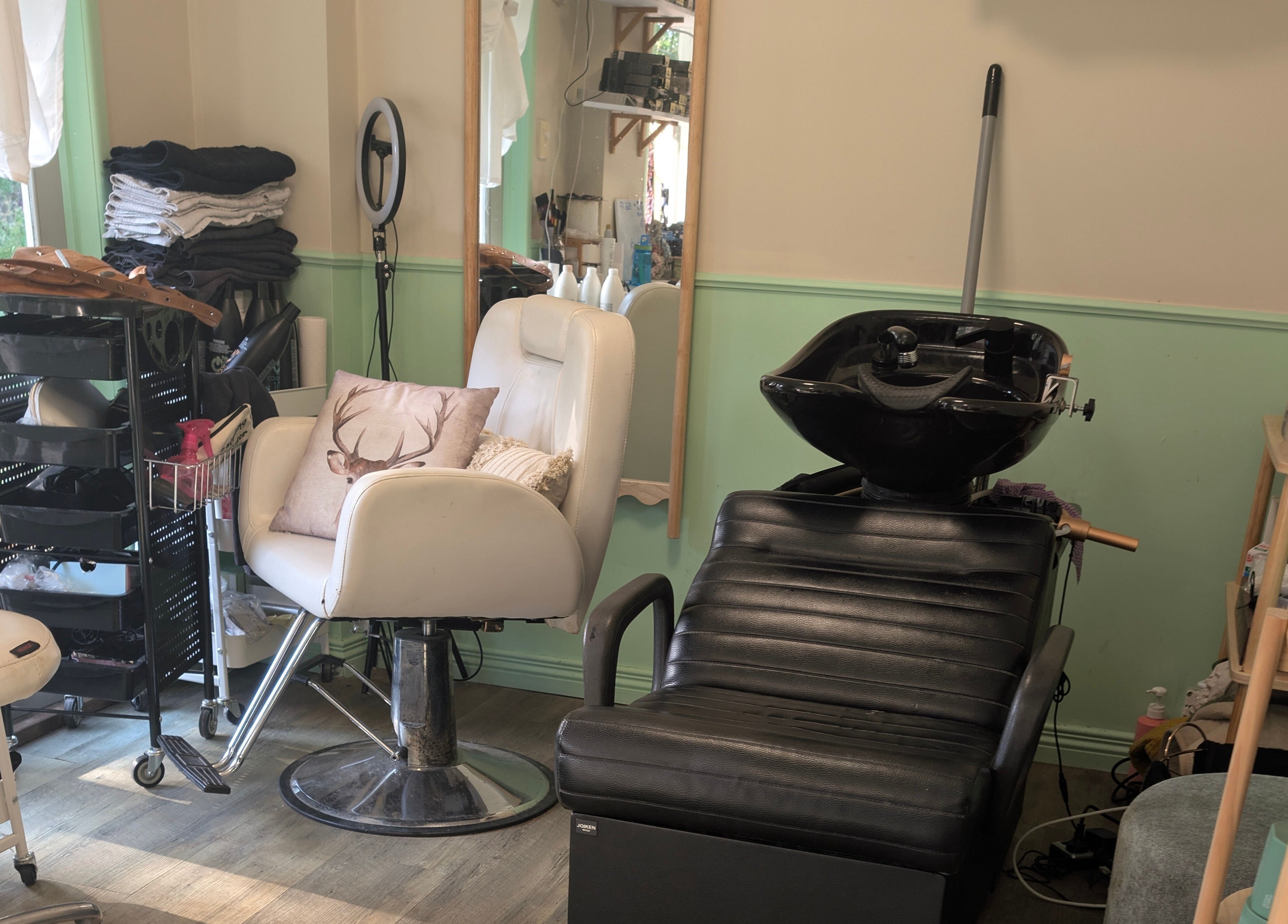 Cozy salon area at Awesome Hair Is, Eagleby, Queensland, AU, with modern hairdressing chairs and products.