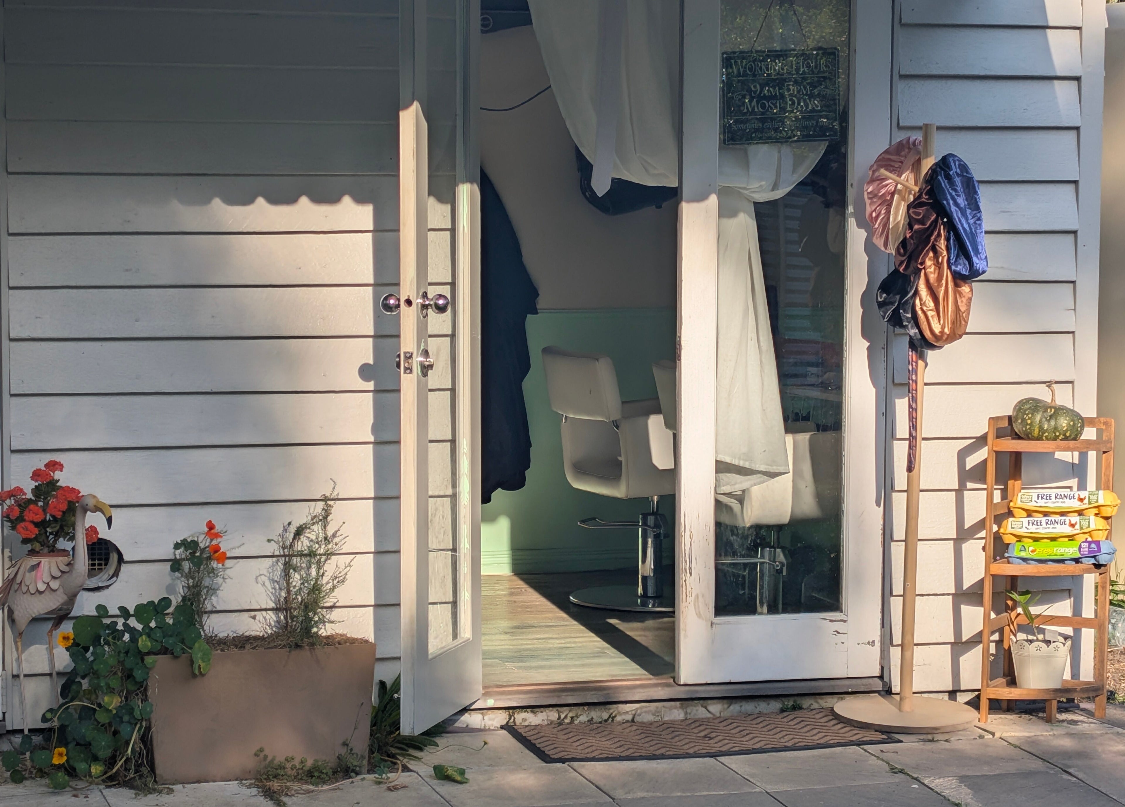 Inviting entrance to Awesome Hair Is salon in Eagleby, Queensland, AU, showcasing stylish decor and welcoming vibe.