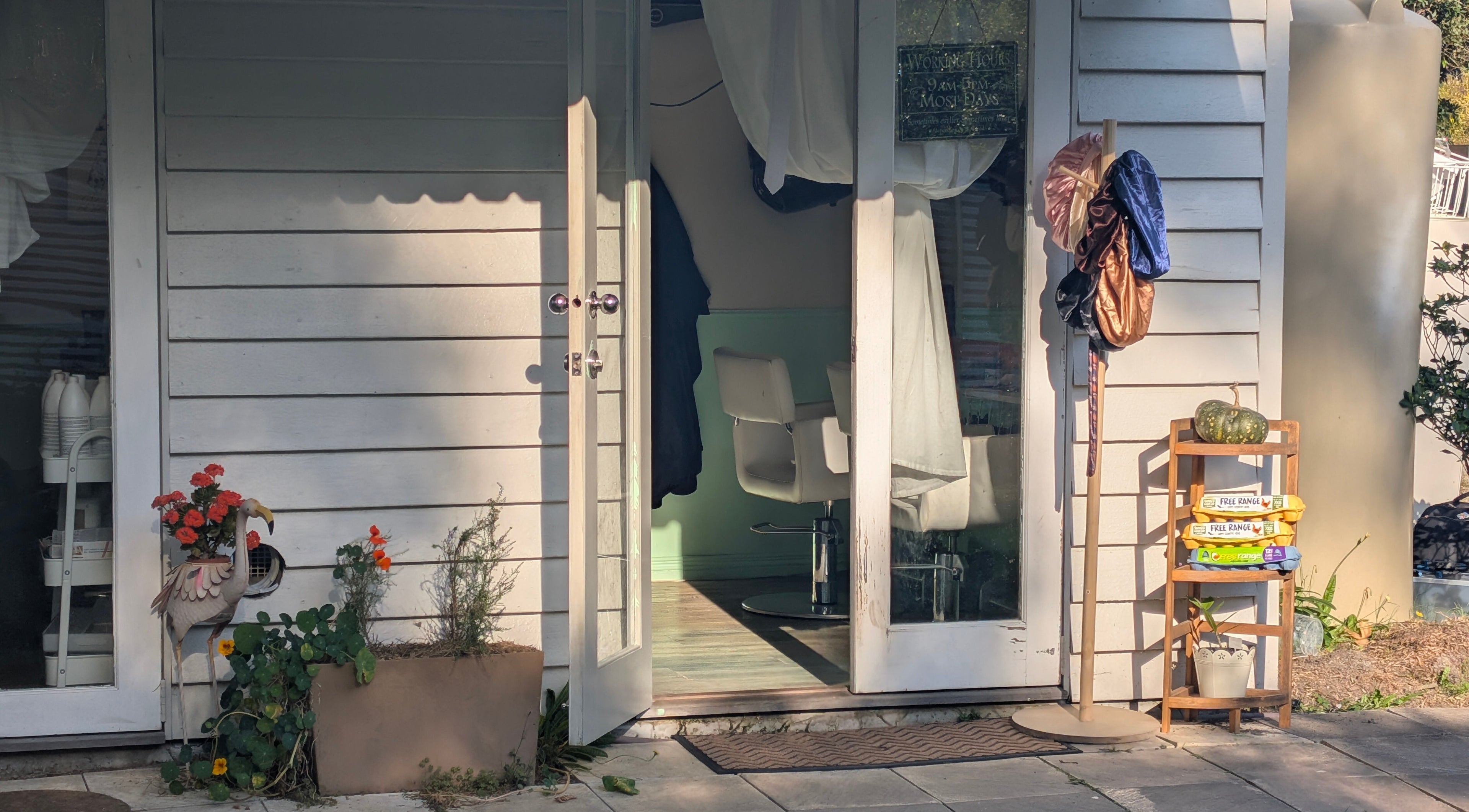 Inviting entrance to Awesome Hair Is salon in Eagleby, Queensland, AU, showcasing stylish decor and welcoming vibe.