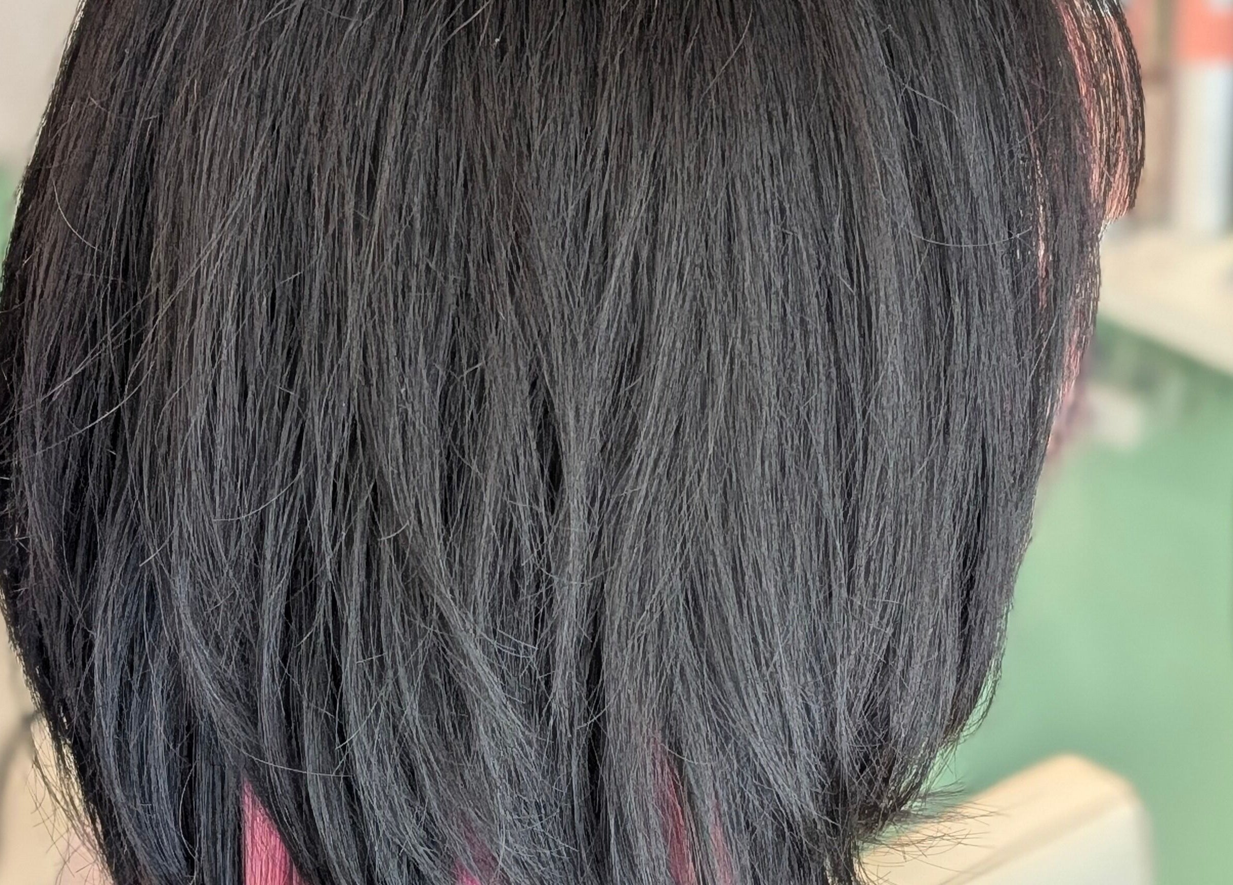 Sleek black hairstyle showcasing expert cut at Awesome Hair Is, Eagleby, Queensland, AU.