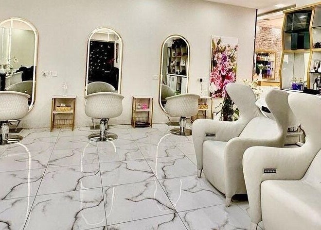 Lavish interior of Rebo Beauty Salon in Dubai, AE, showcasing stylish chairs and mirrors.