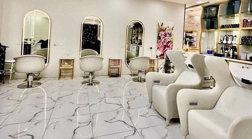 Lavish interior of Rebo Beauty Salon in Dubai, AE, showcasing stylish chairs and mirrors.