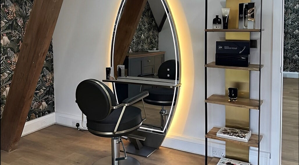 Modern salon chair and illuminated mirror at Anthony James, Pattingham, GB showcasing stylish design.