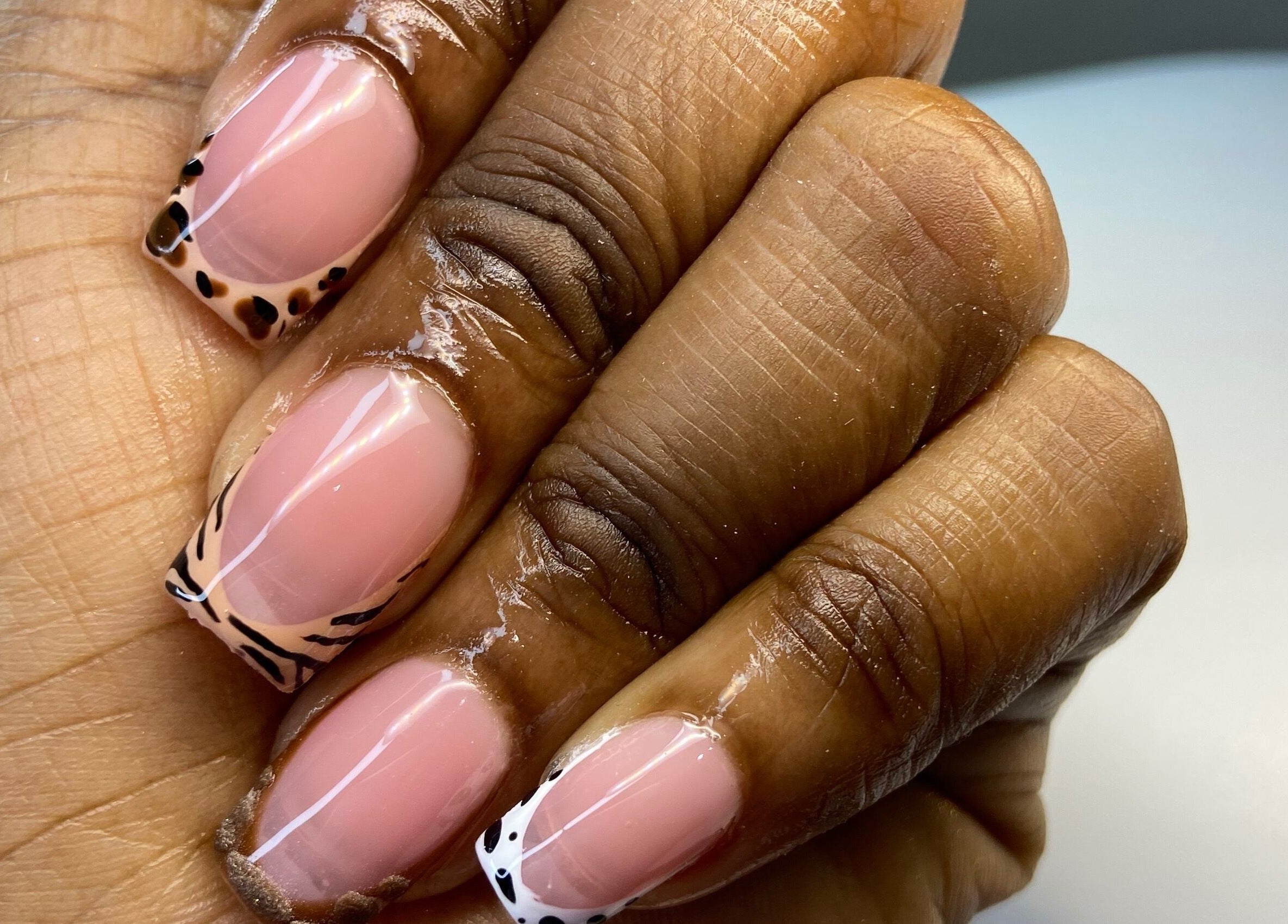 For Love & Lemons | The Nail Studio in Saint Philip, BB offers stylish animal-print nail art design.