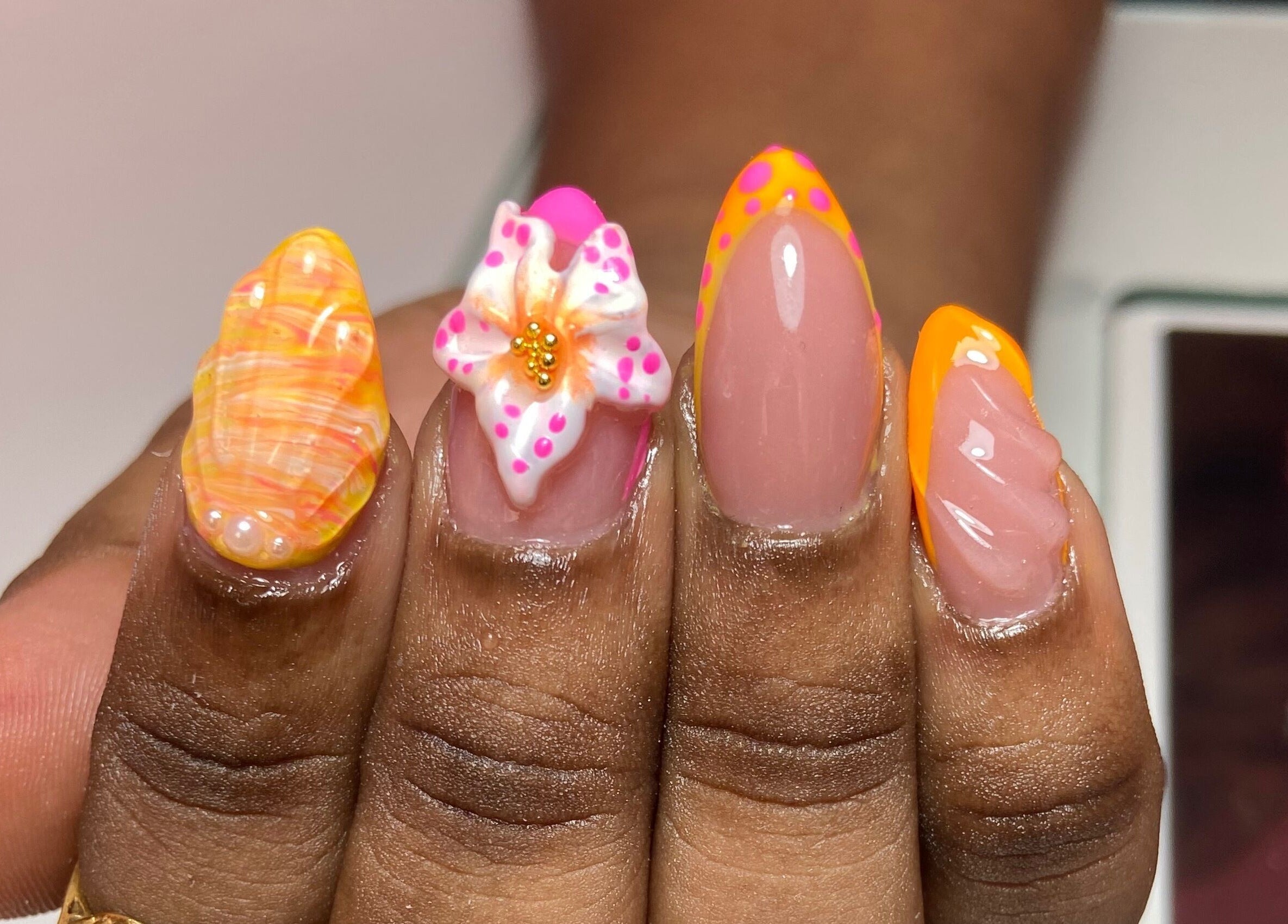 Vibrant nail art at For Love & Lemons | The Nail Studio, Saint Philip, BB with floral and abstract designs.