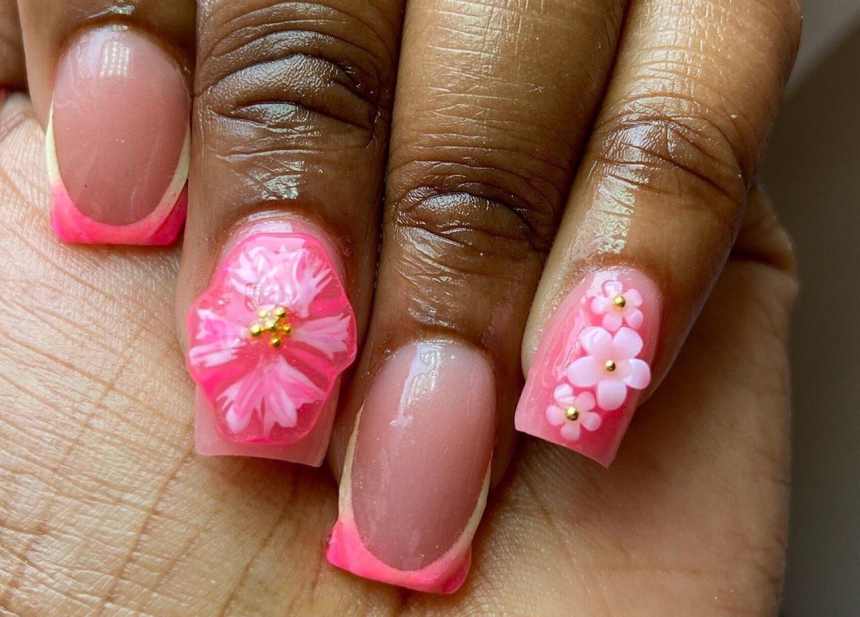 Intricate pink floral nail art at For Love & Lemons | The Nail Studio, Saint Philip, BB, exudes elegance.