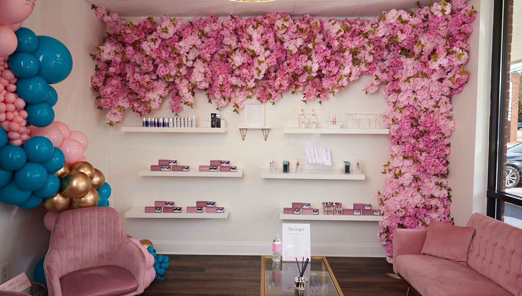 Pink floral wall and plush seating at Lajori’s Beauty Bar and Spa, Stockbridge, Georgia, US.