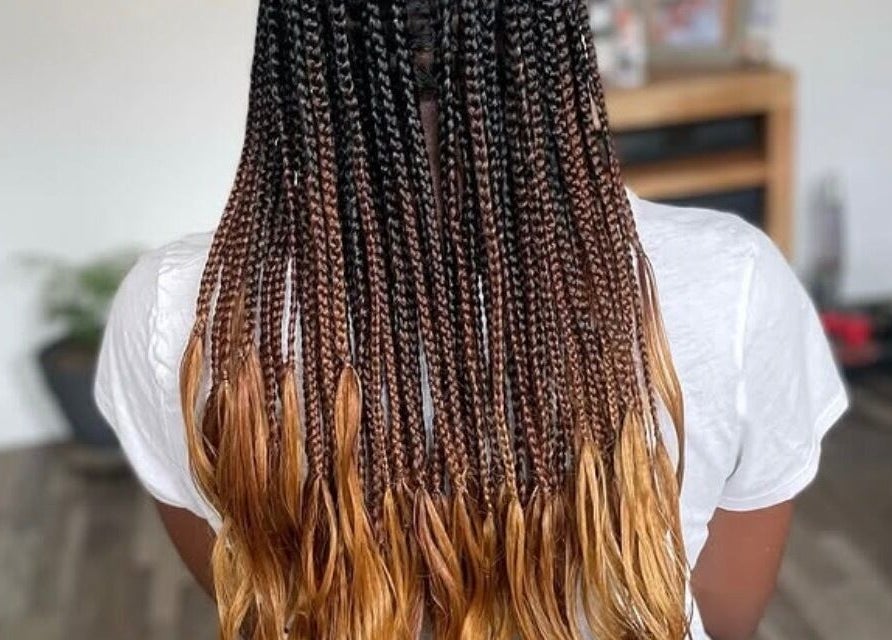 Intricate golden ombre braids at Jay's Braid Studio, Bristol, England, GB. Stunning hair artistry and style.