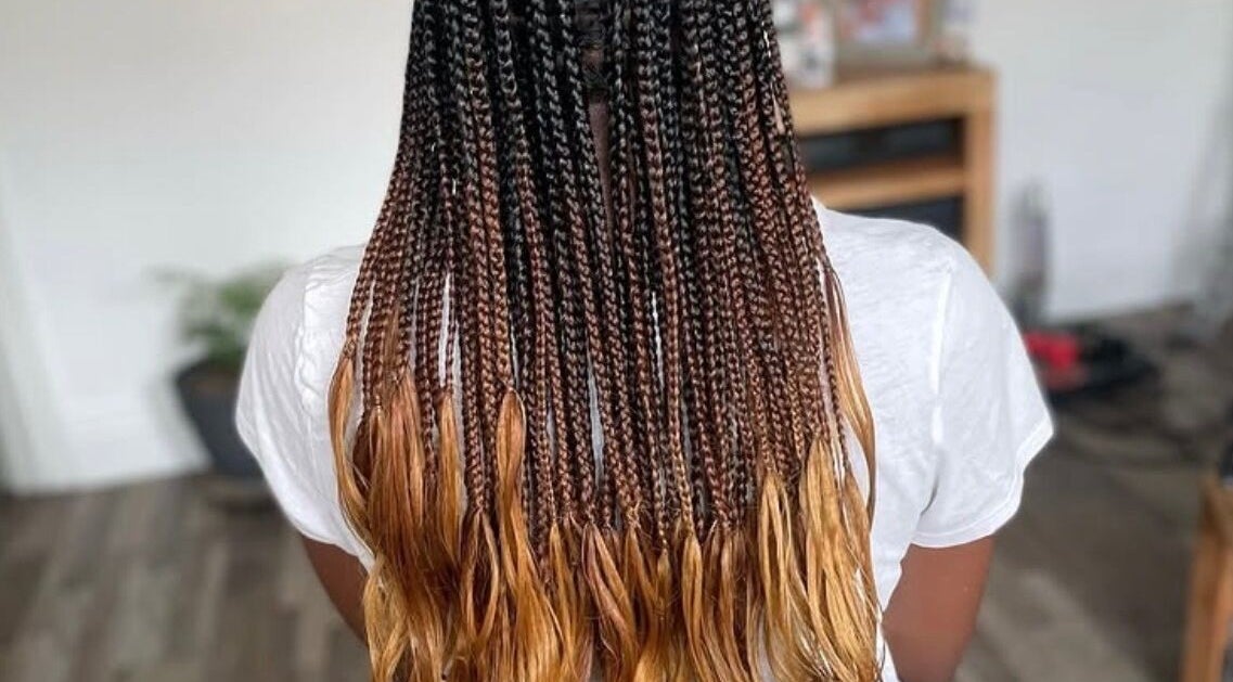 Intricate golden ombre braids at Jay's Braid Studio, Bristol, England, GB. Stunning hair artistry and style.