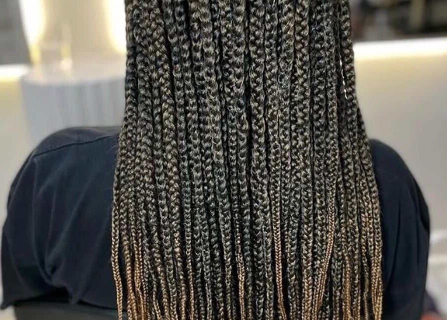 Detailed view of elegant braids at Jay's Braid Studio, Bristol, England, GB, showcasing fine craftsmanship.