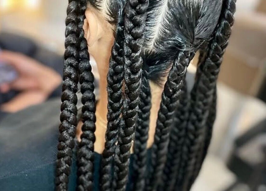 Intricate braids at Jay's Braid Studio, Bristol, England, GB showcasing expert styling.