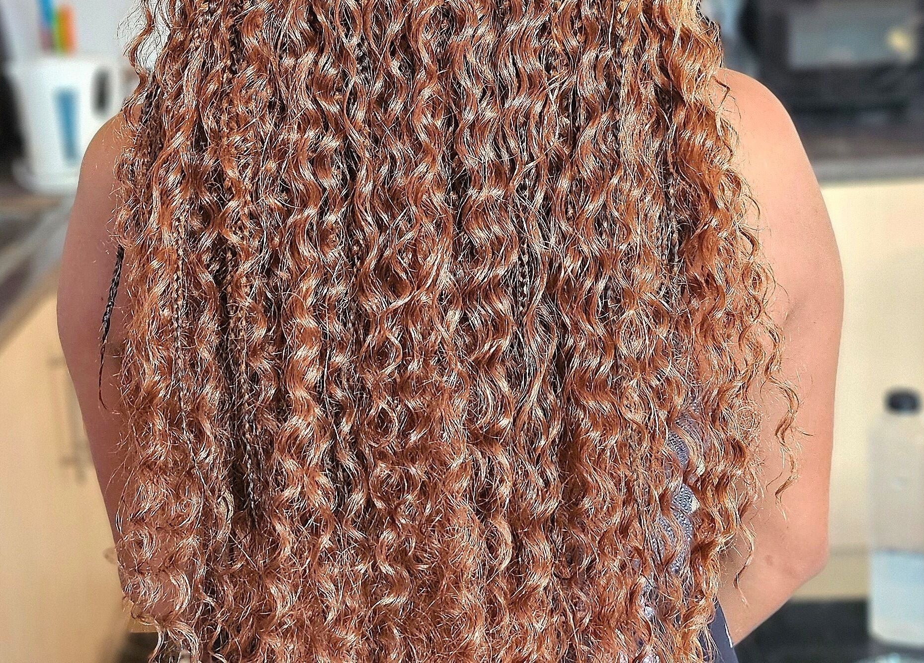 Beautiful curly hairstyle at Jay's Braid Studio, Bristol, England, GB showcasing intricate braiding.